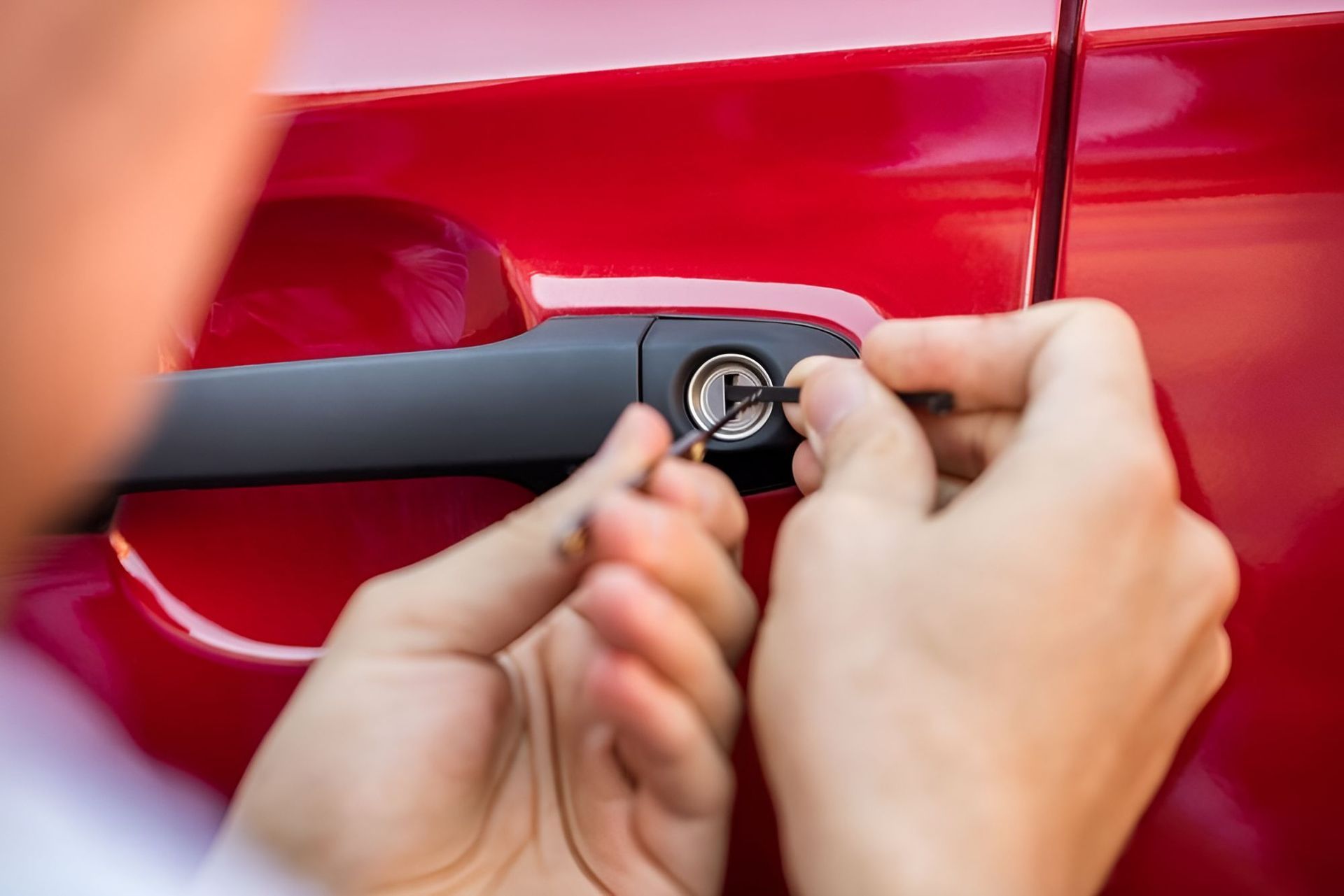 A Person Is Opening A Car Door With A Key — Cairns Roadside Assist In Atherton, QLD