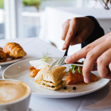 person eating breakfast