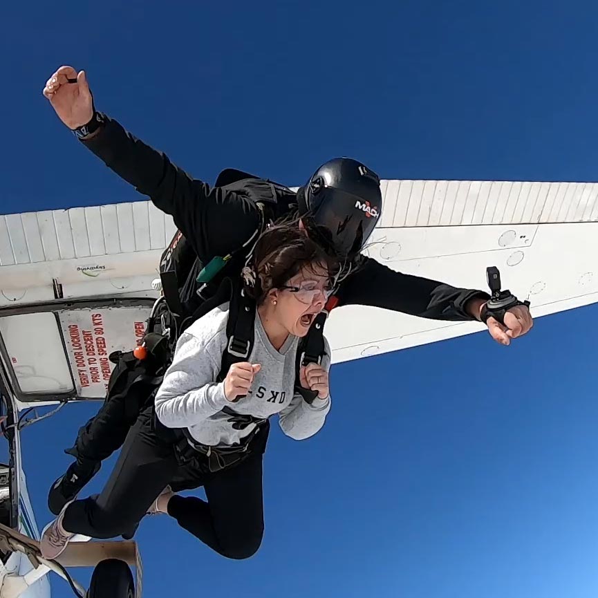 Tandem skydive leaving the plane, passenger is screaming