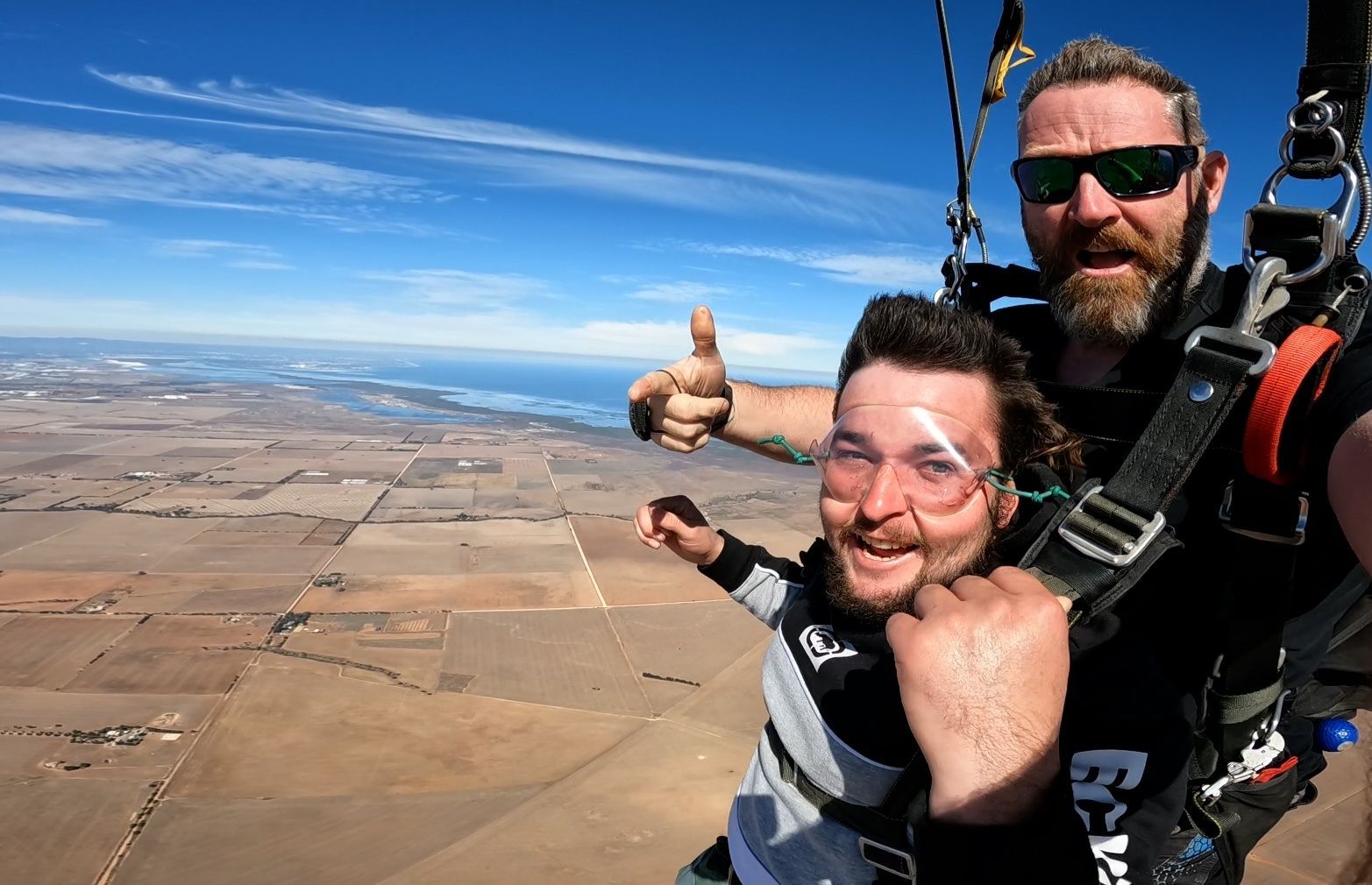 Tandem skydivers gliding