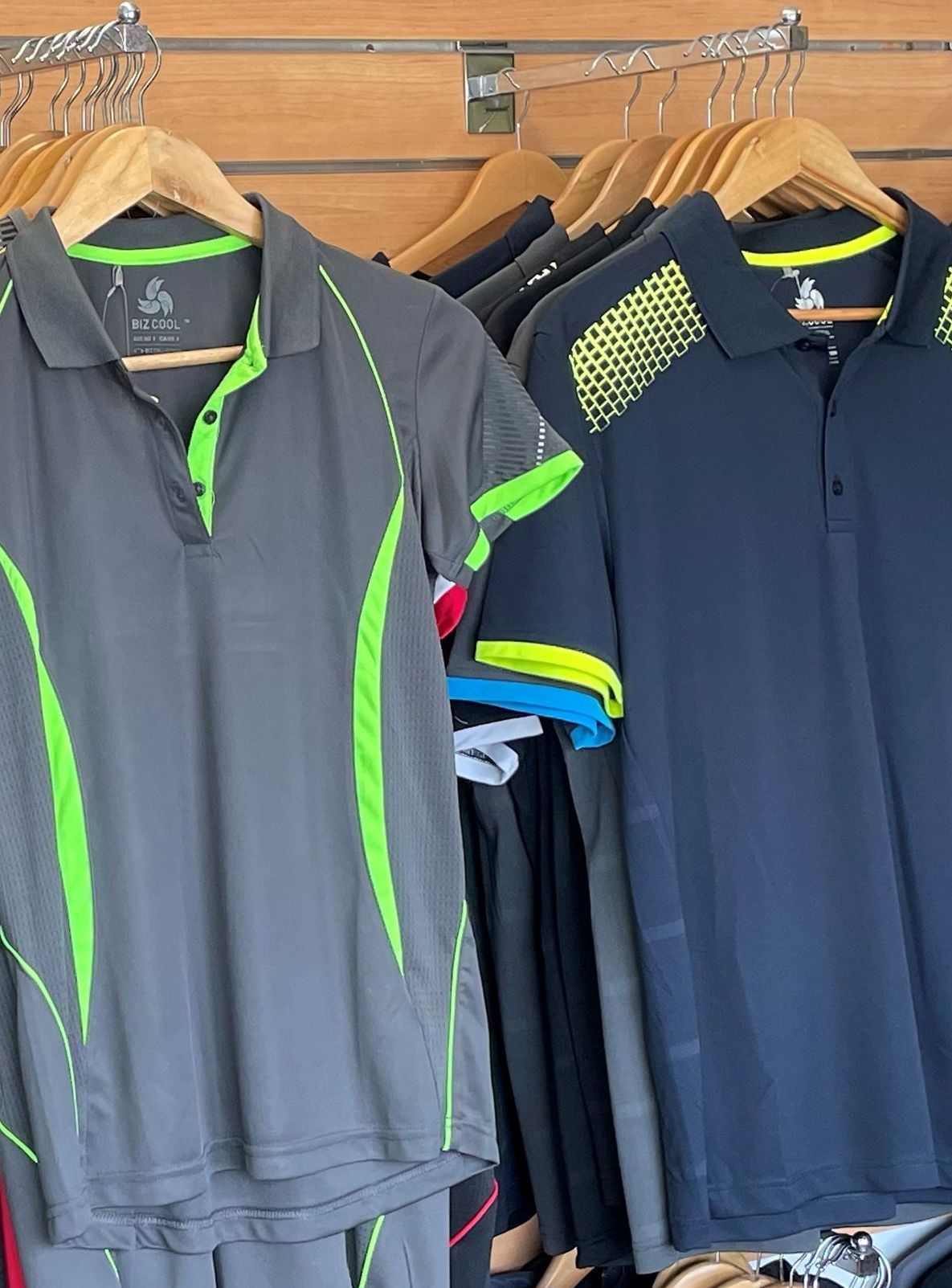 High-quality T-shirts on a wooden coat hanger — Screen Printer in Dubbo, NSW