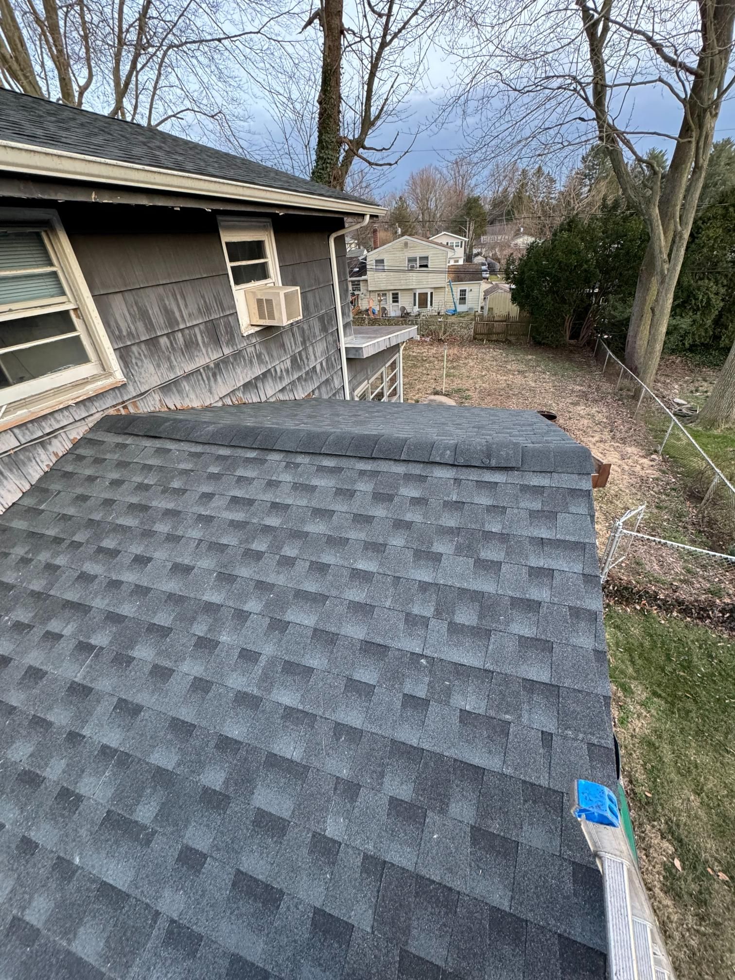 A house with a roof that is being installed.