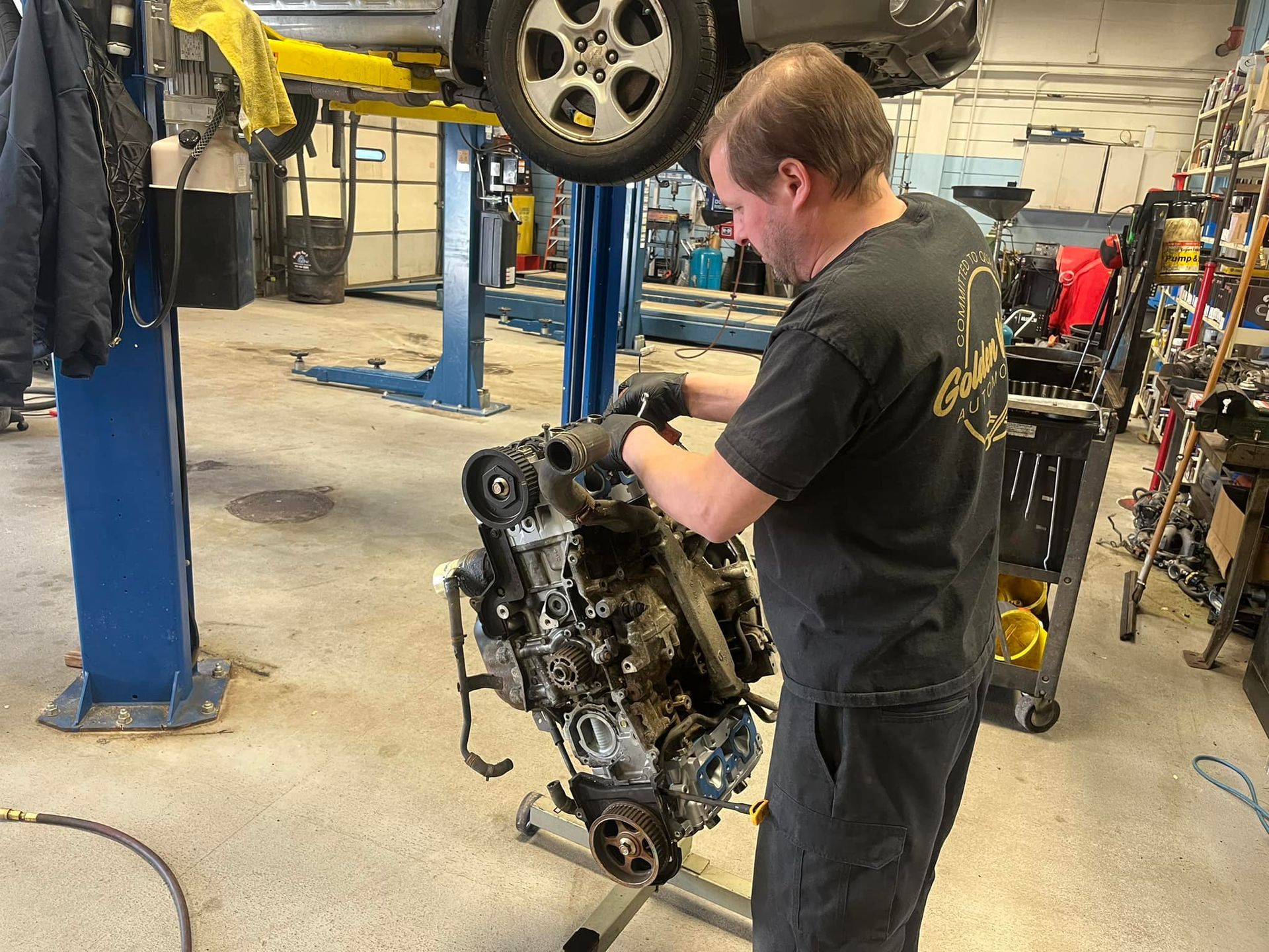 A Mechanic Is Working on a Car Engine in a Garage | Golden Valley Automotive