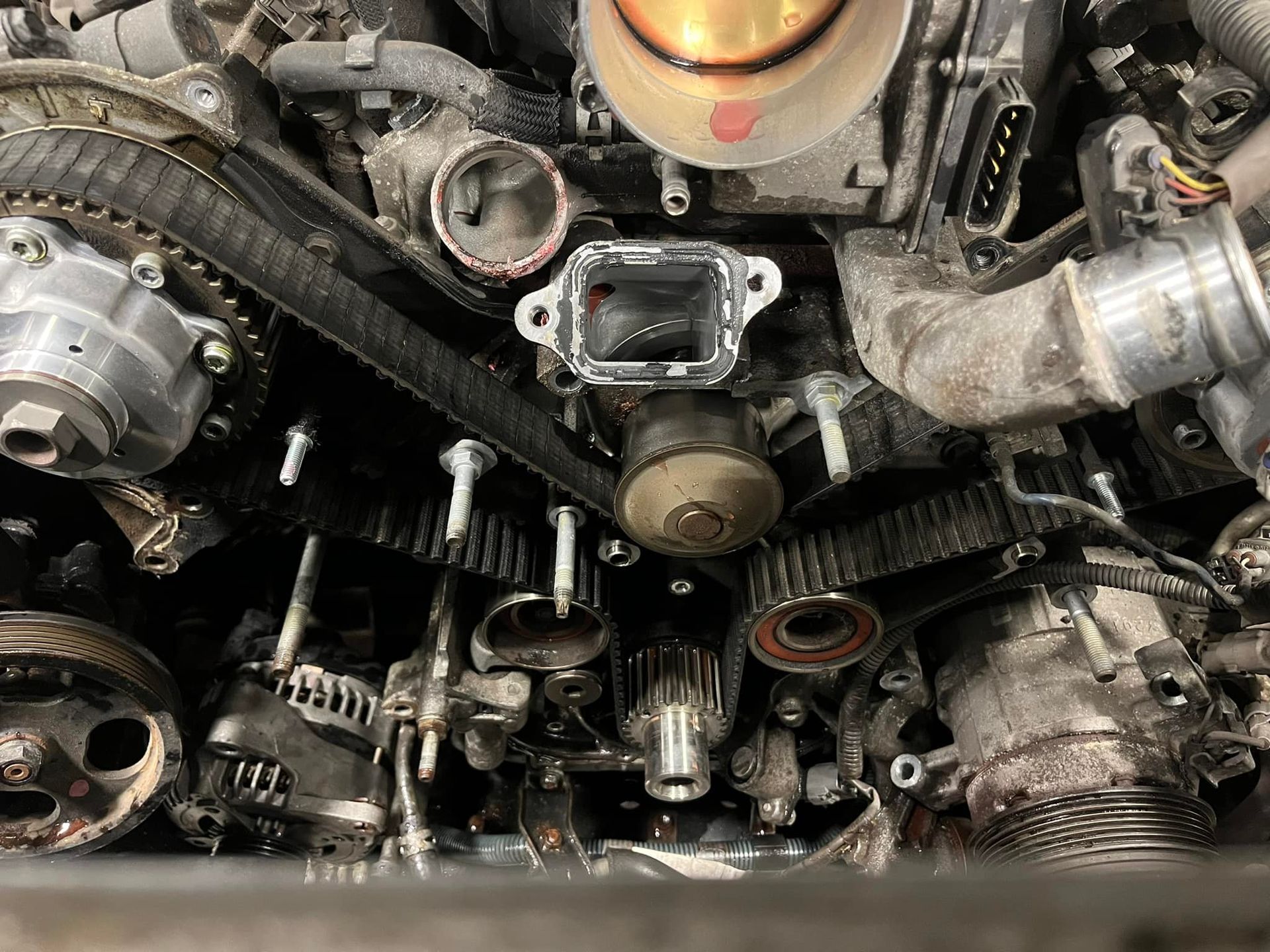 A Close Up of a Car Engine With a Belt on It | Golden Valley Automotive