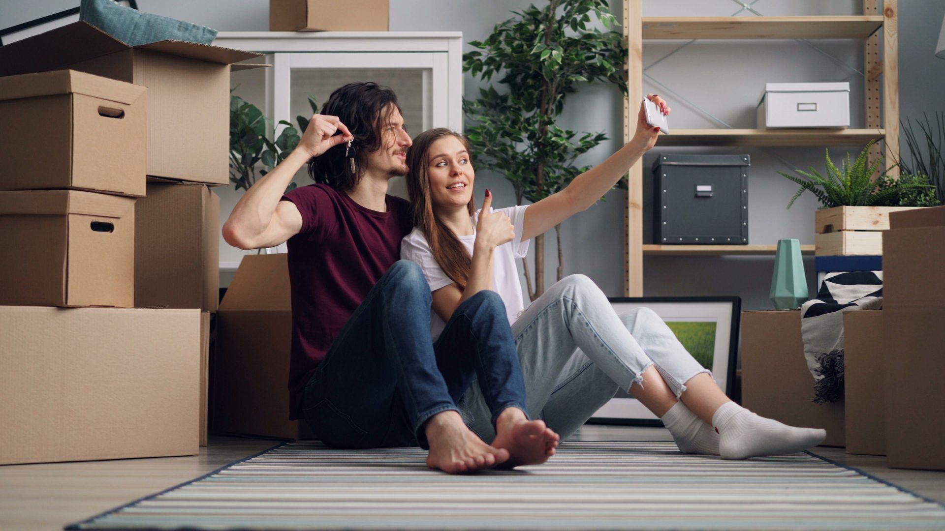 Tenants sitting by cardboard boxes