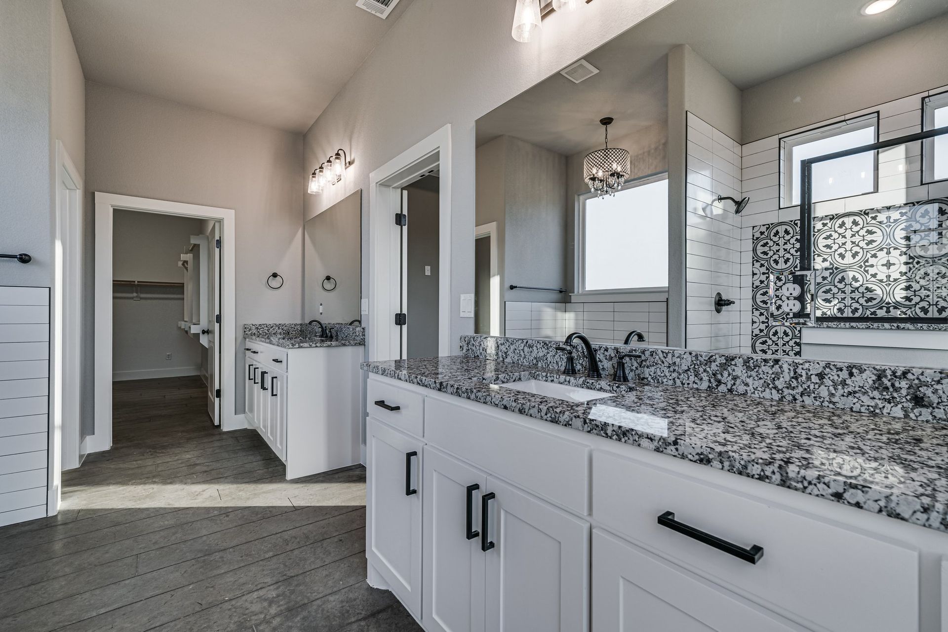 modern bathroom with double vanity and granite countertops
