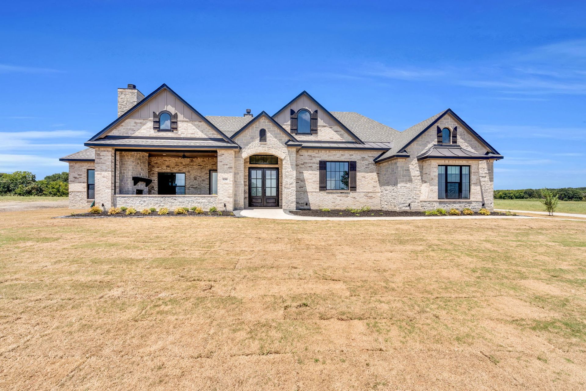 aerial view of custom home with backyard pool in North Texas