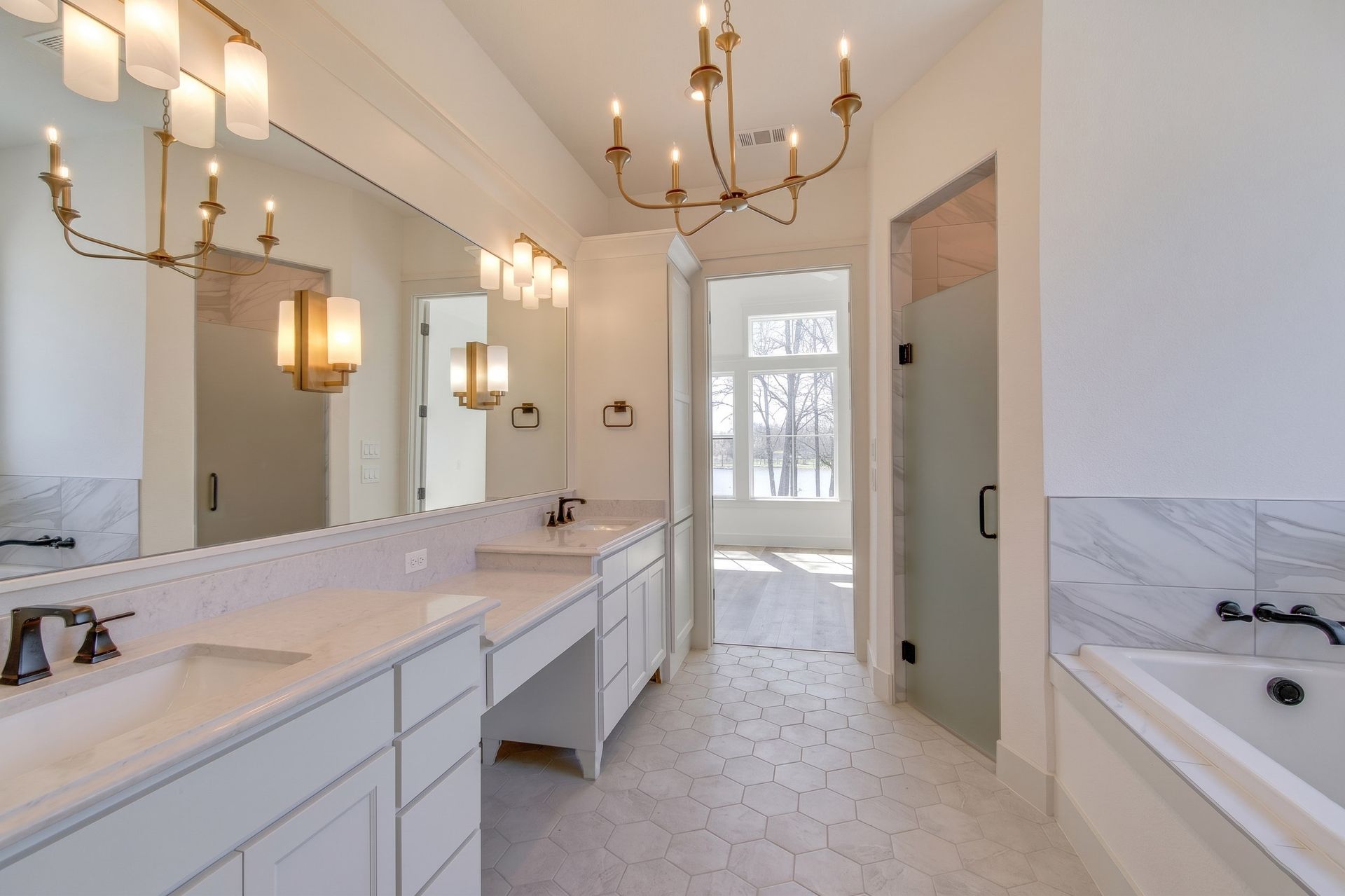 modern bathroom remodel with double vanity and gold fixtures