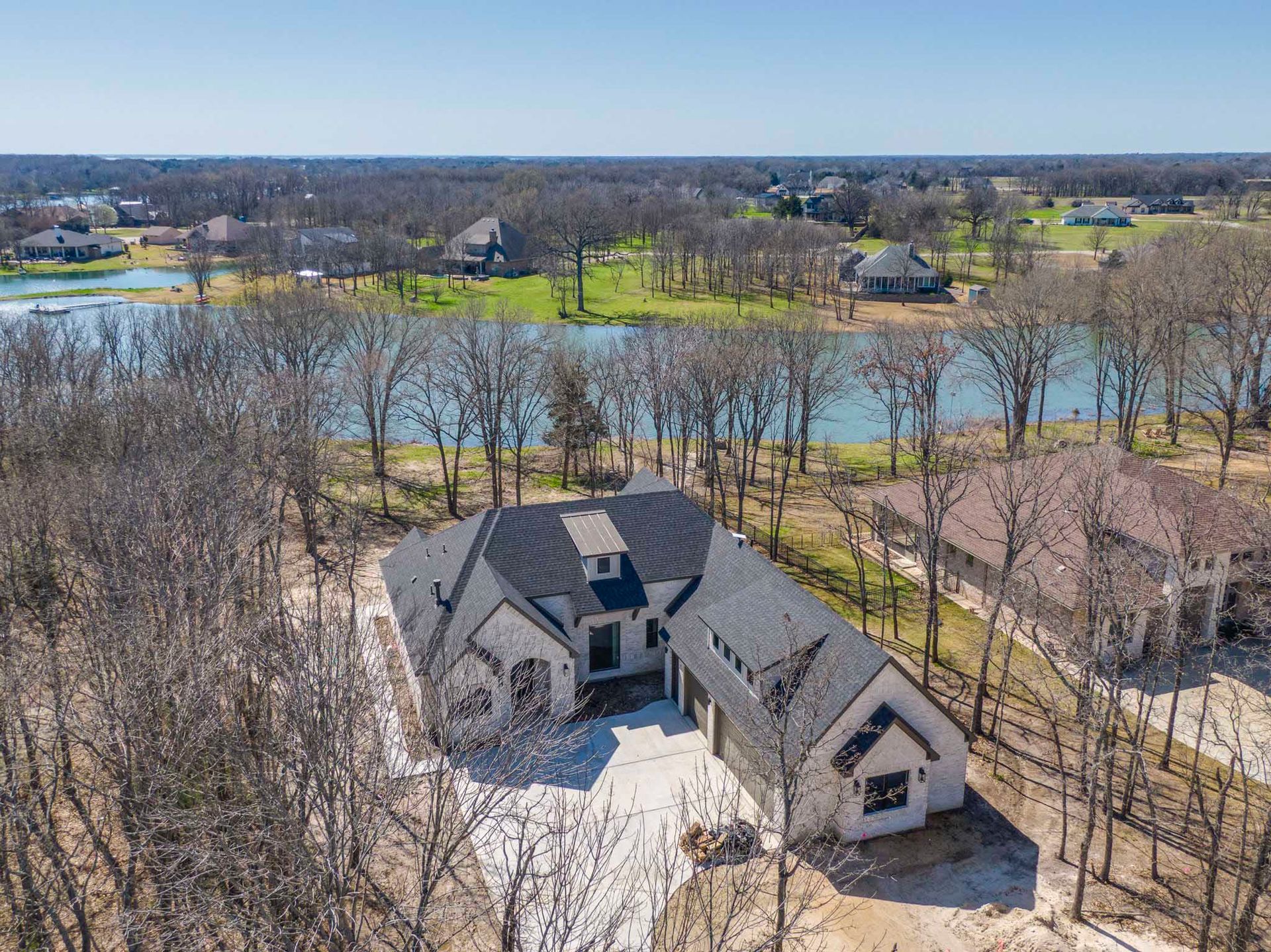 aerial view of custom home near lake in DFW area
