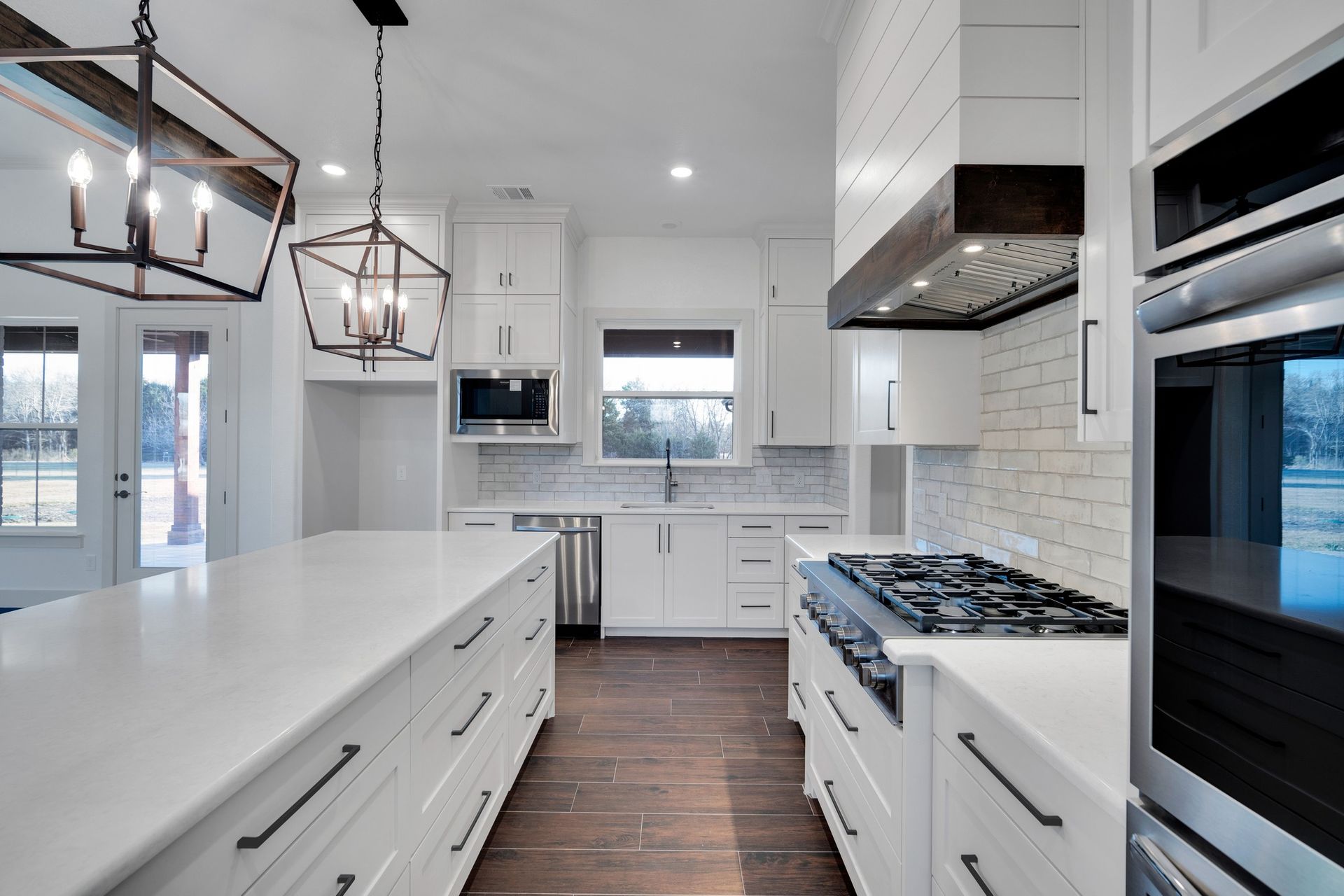 custom white kitchen with island and modern finishes