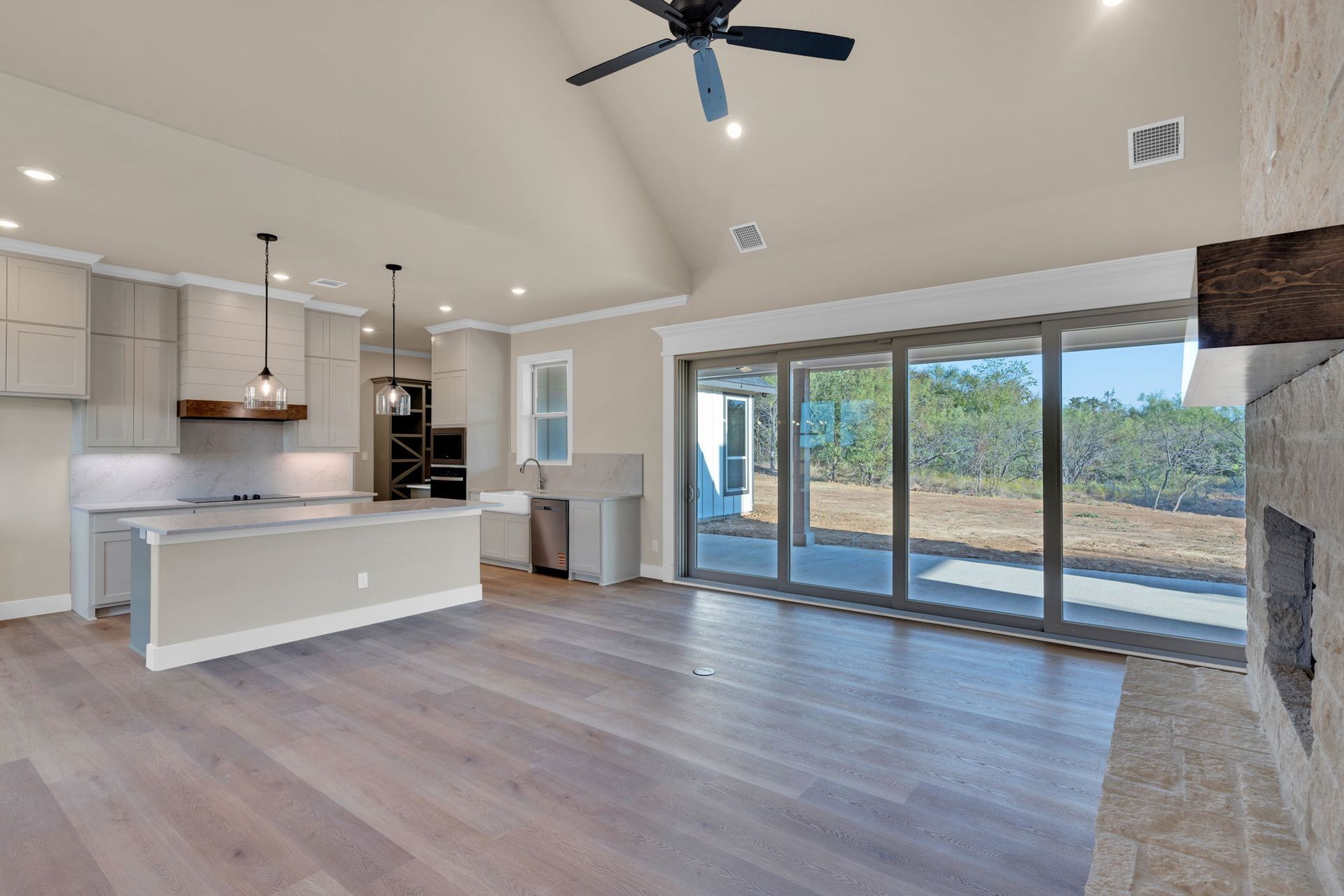 open concept kitchen with large windows and modern finishes