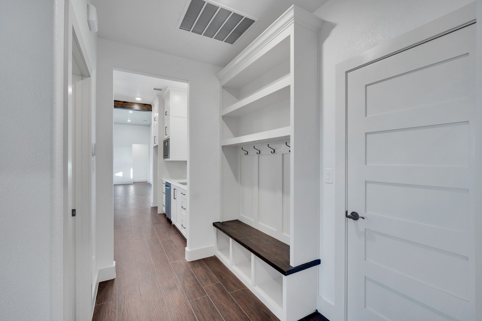 mudroom with built-in storage and bench seating