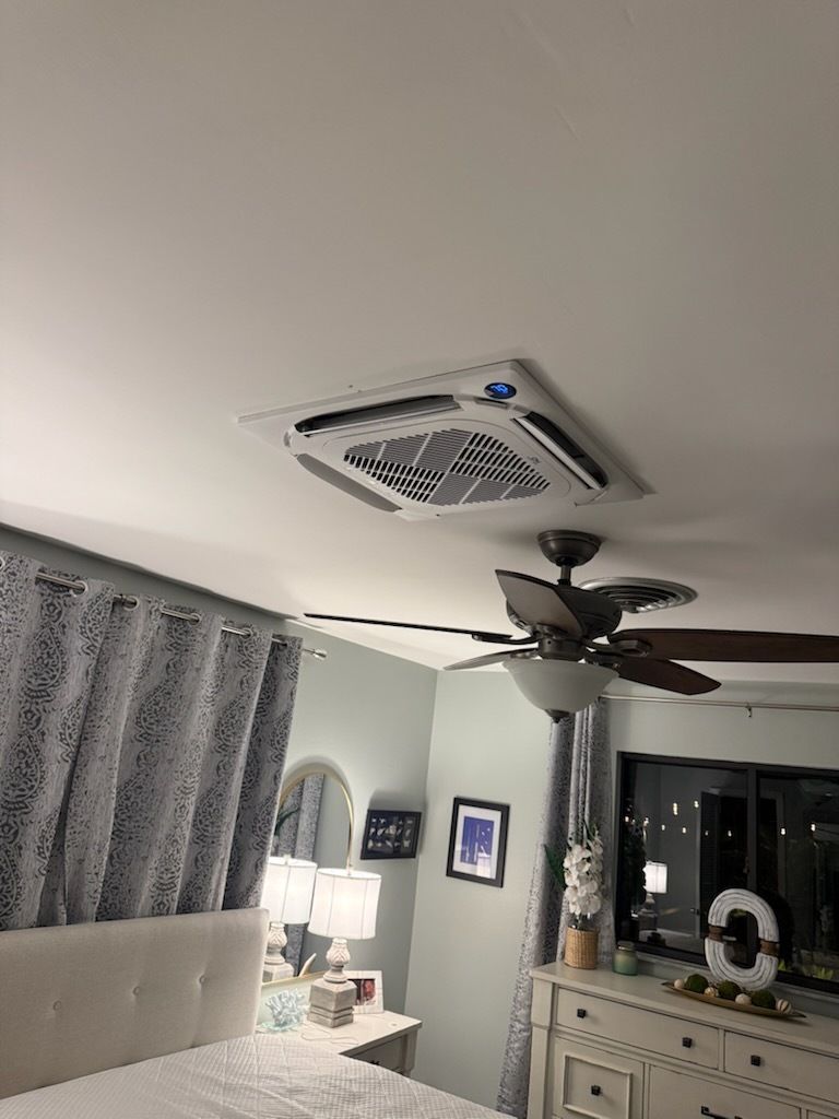 Bedroom ceiling with fan, air vent, curtains, dresser, and soft lamp lighting