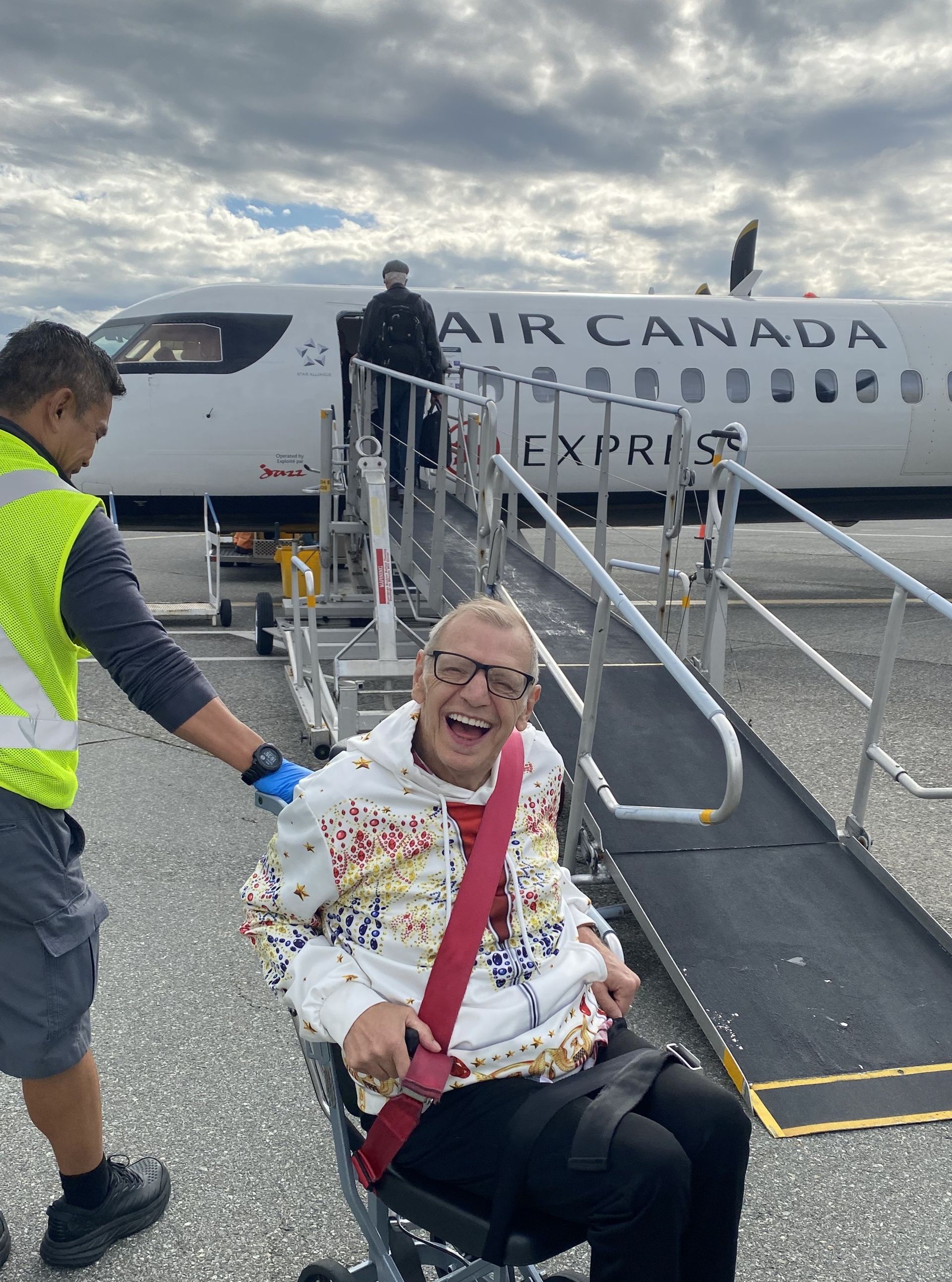 A man is waiting to board an Air Canada plane