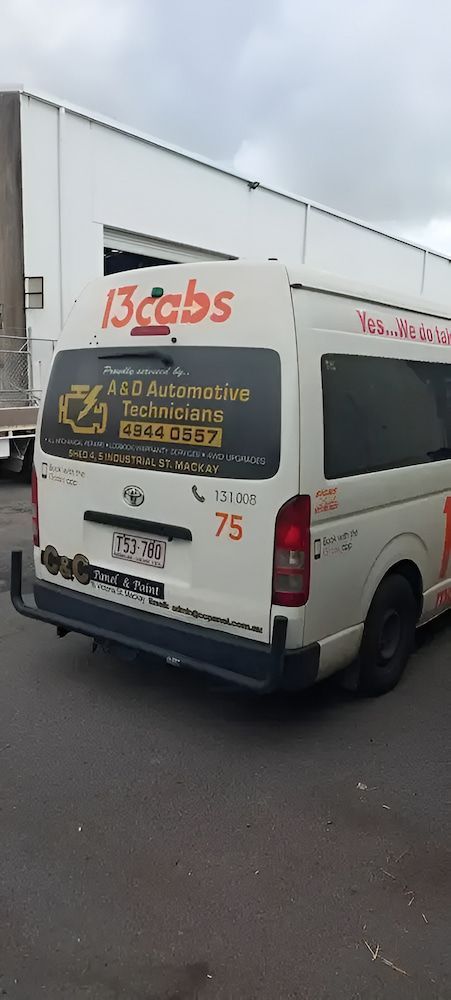 A White Van Is Parked In Front Of A Building — A & D Automotive Technicians in Mackay, QLD