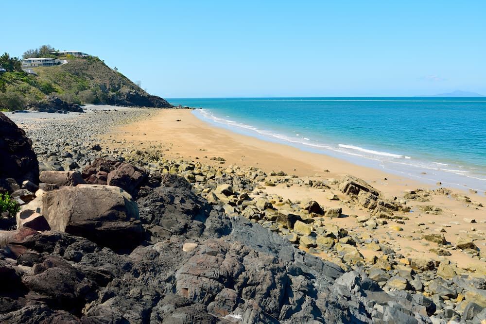 A Rocky Beach With A Large Body Of Water — A & D Automotive Technicians in Mackay, QLD