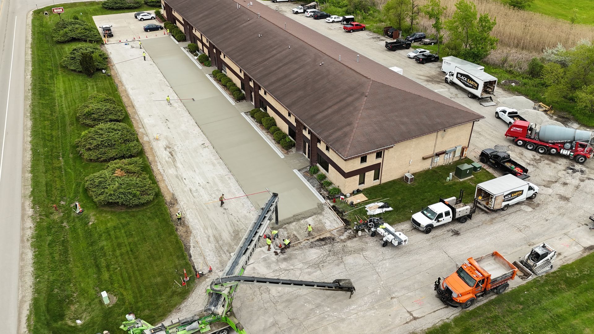 Aerial view of Black Earth Pavement crew installing concrete at a commercial property