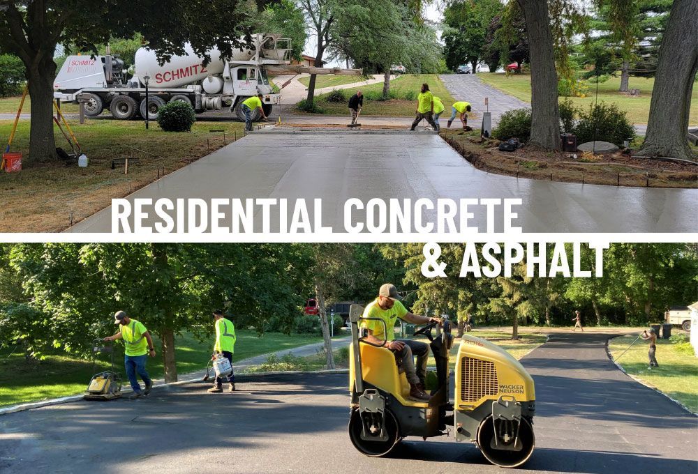 Road crew paving residential concrete and asphalt, with workers and a yellow roller on a tree-lined street