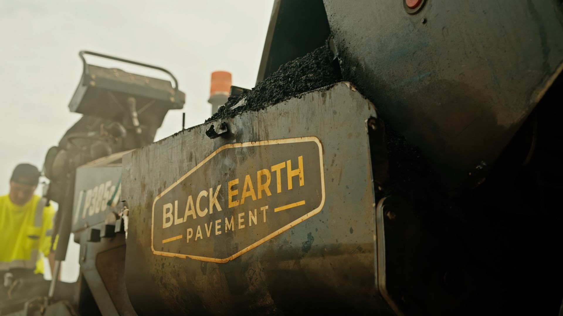 Black Earth Pavement asphalt paving equipment during a paving project