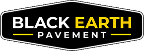 Black and gold Black Earth Pavement logo on a black sign shape