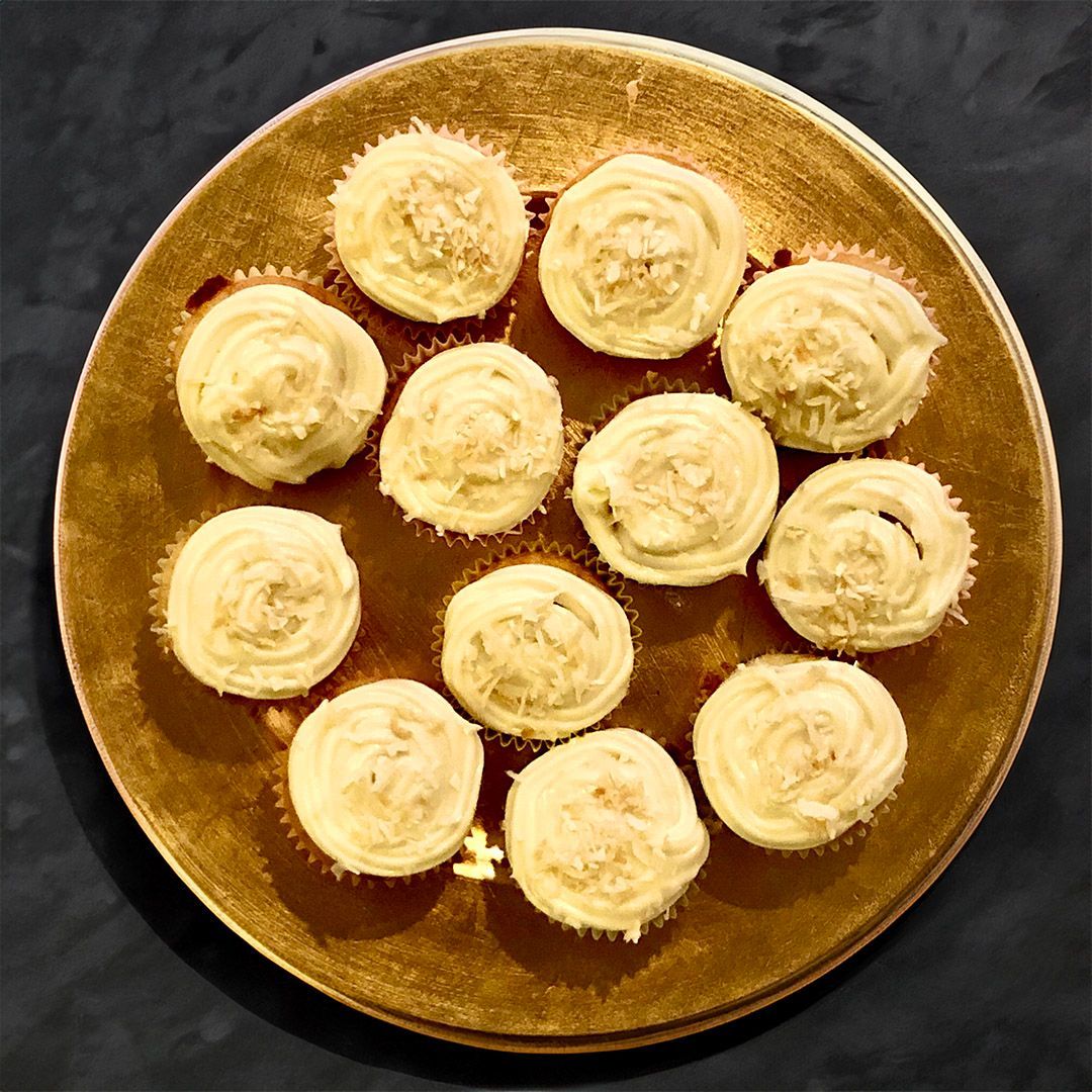 Cupcakes with vanilla frosting and coconut