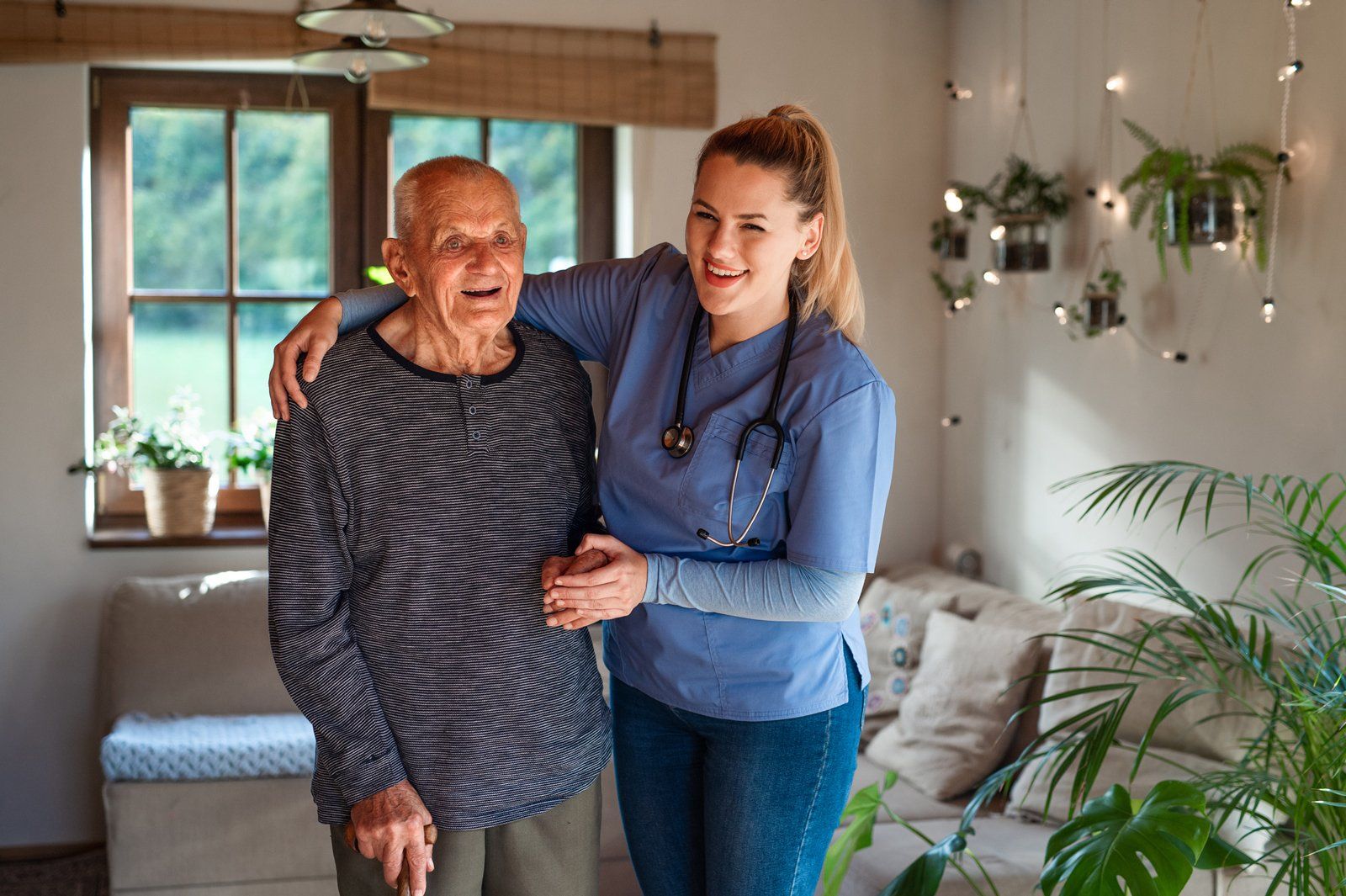 Caregiver Visiting Senior Man Indoors At Home — Jackson, MS — Prime Care Nursing Caregiver Visiting Senior Man Indoors At Home — Jackson, MS — Prime Care Nursing
