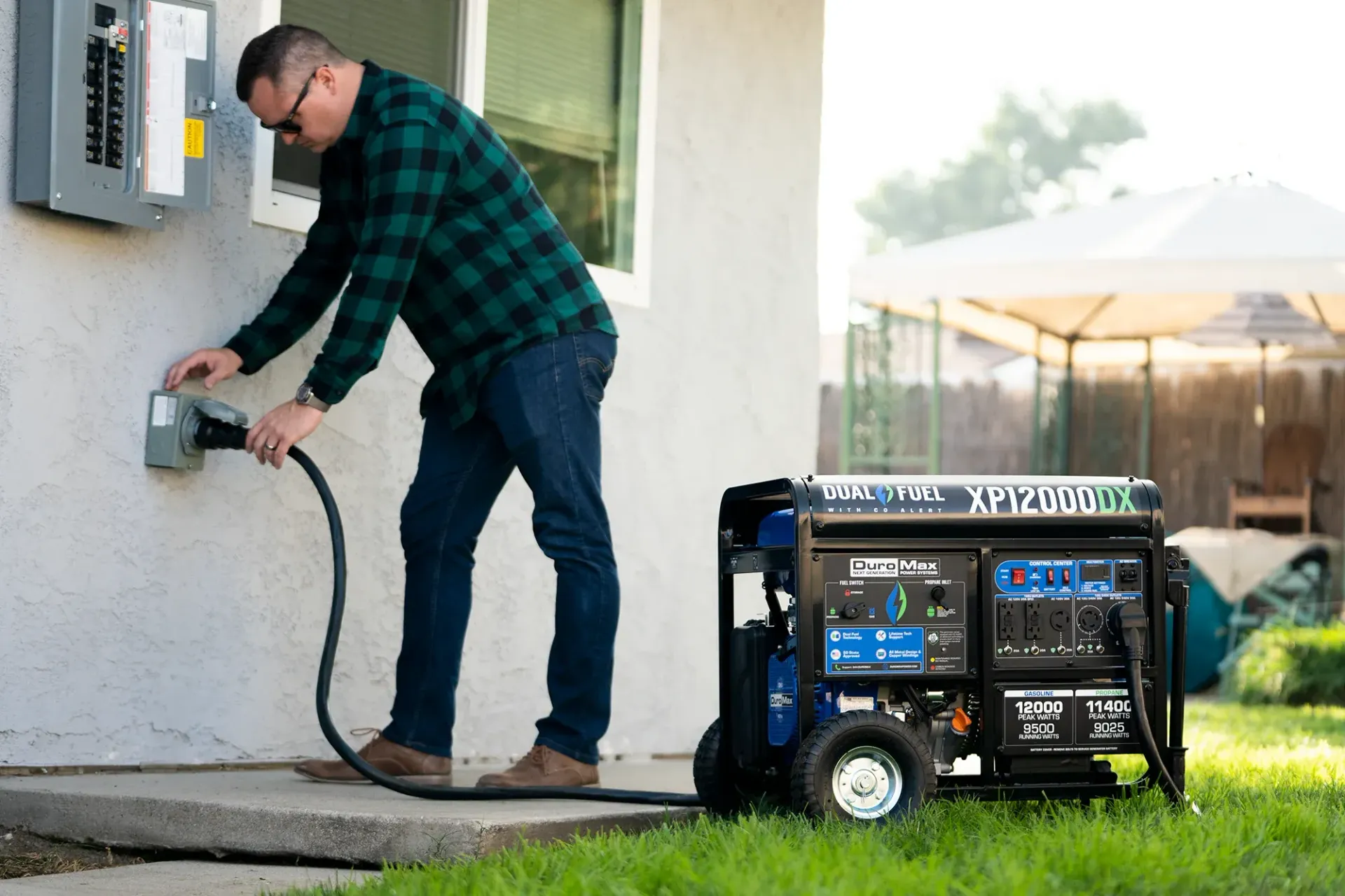 Homeowner connecting a generator through a properly installed transfer switch inlet