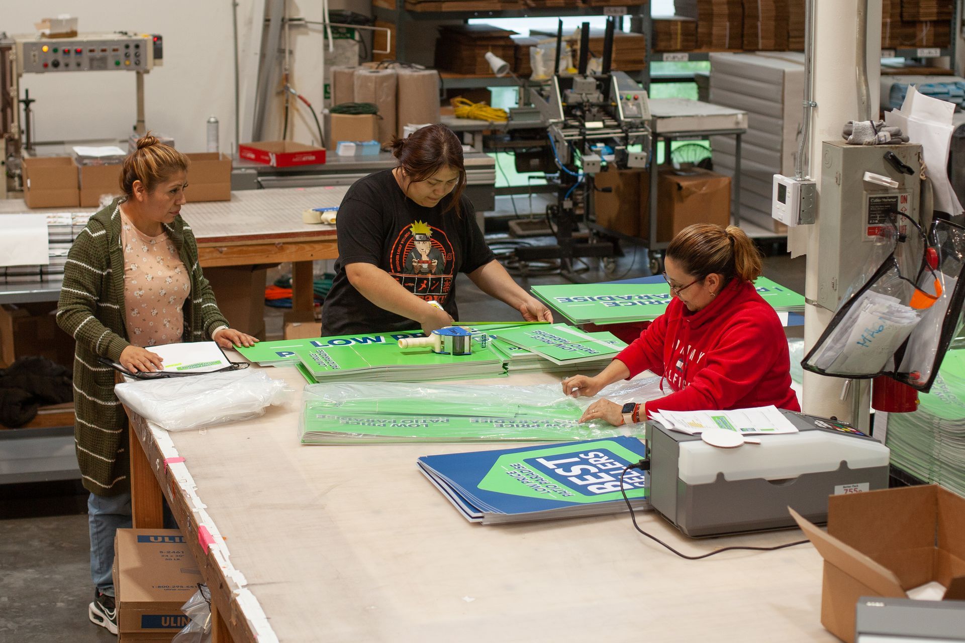 Execuprint team assembling and packing a multi-component print project