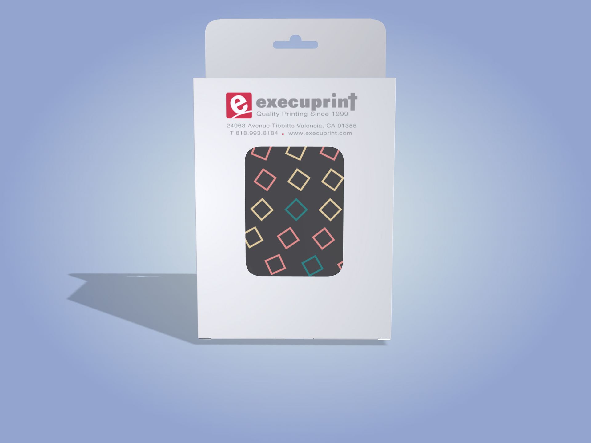 White product box with window showing a patterned playing card, with a light blue background.