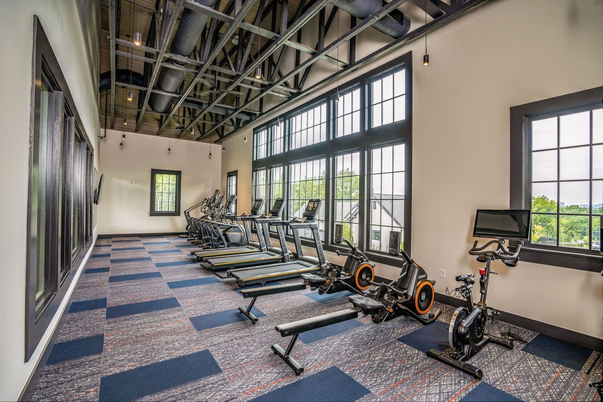Exercise bikes and benches in the fitness center at Livano Trinity.
