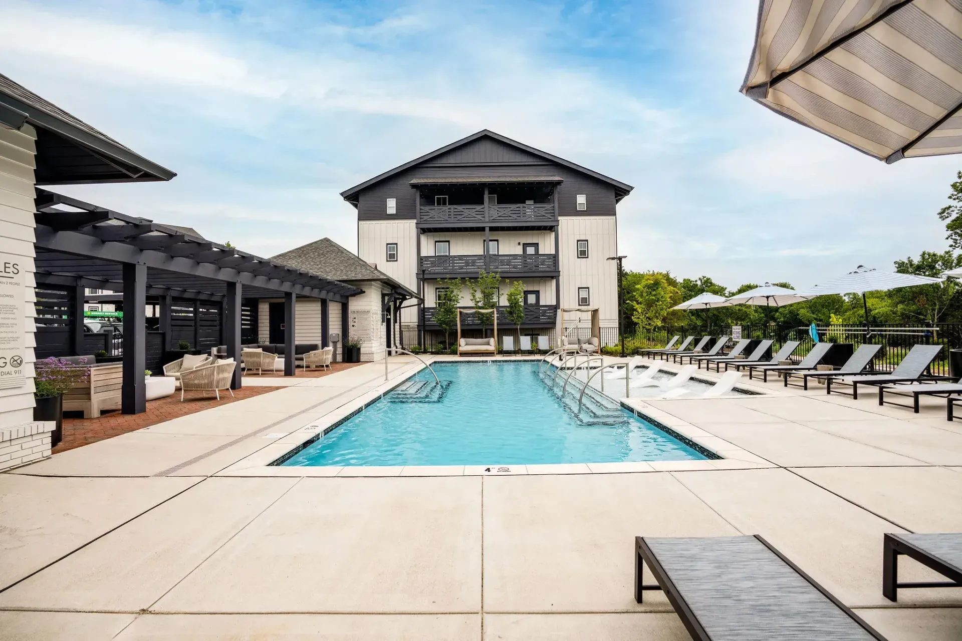 Swimming pool area on a partially cloudy but beautiful day at Livano Trinity.
