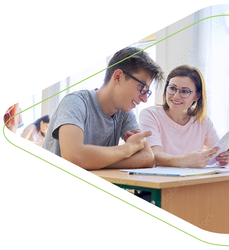 A teacher working with a student