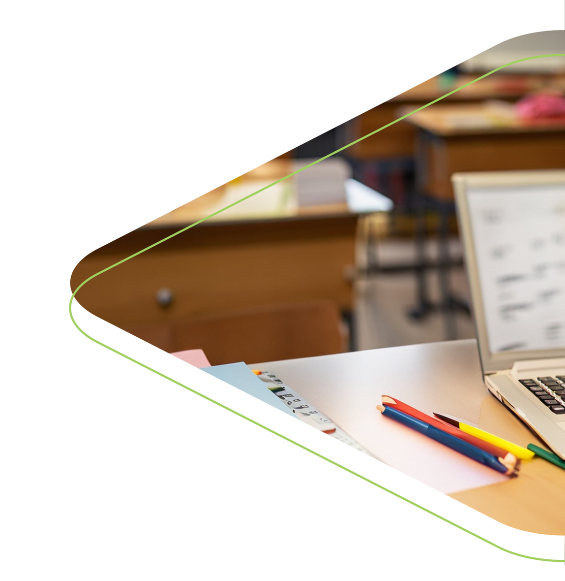 A desk with pens and a laptop