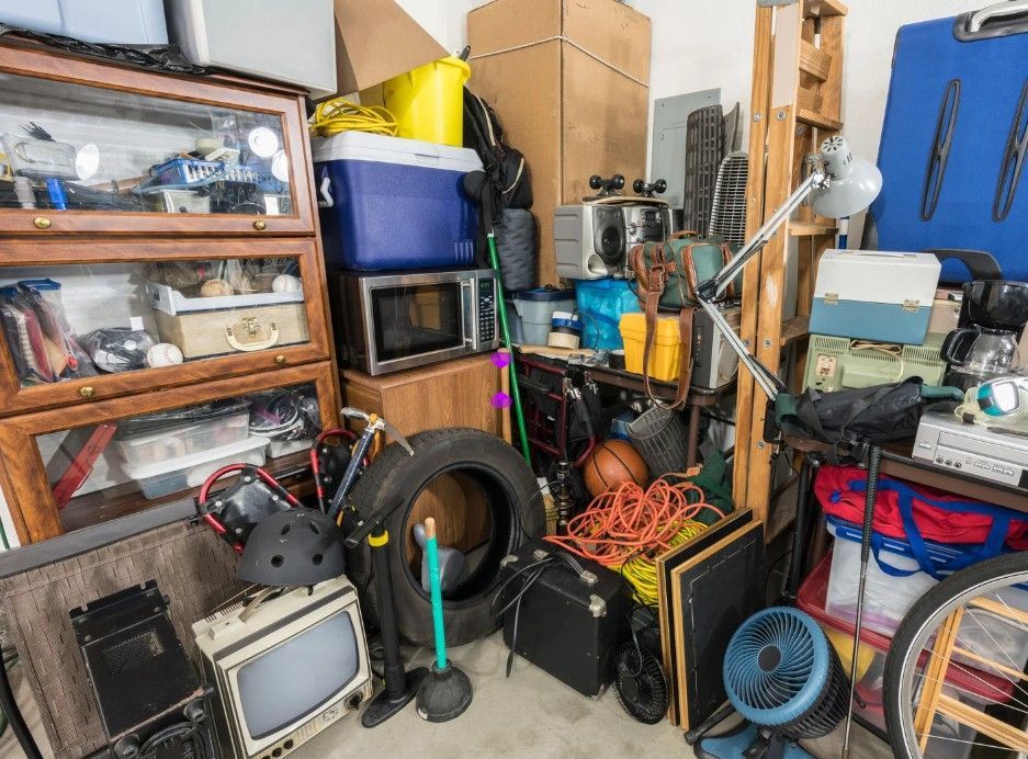 a hoarded house before a bereavement house clearance