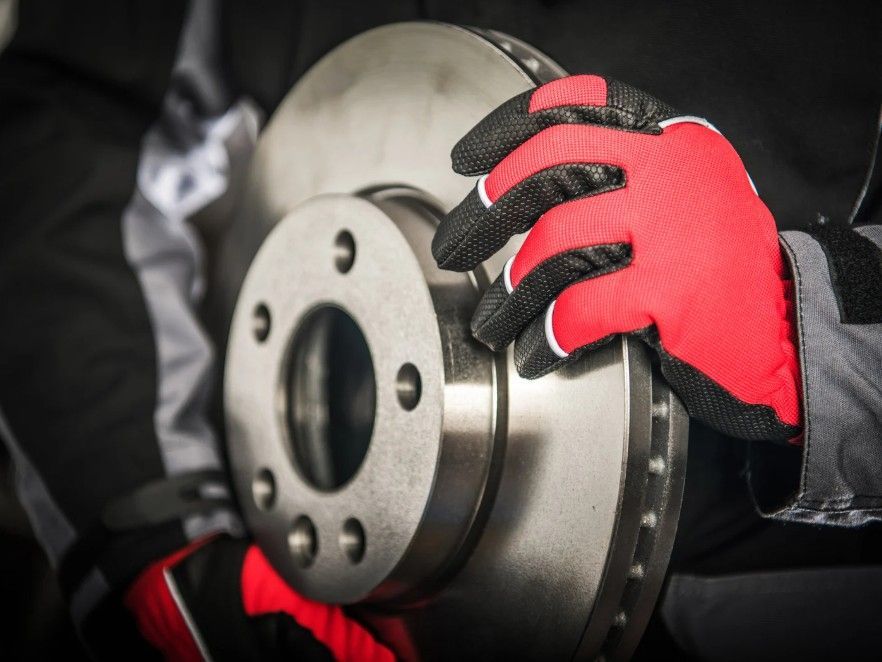 new replacement car brakes being fitted