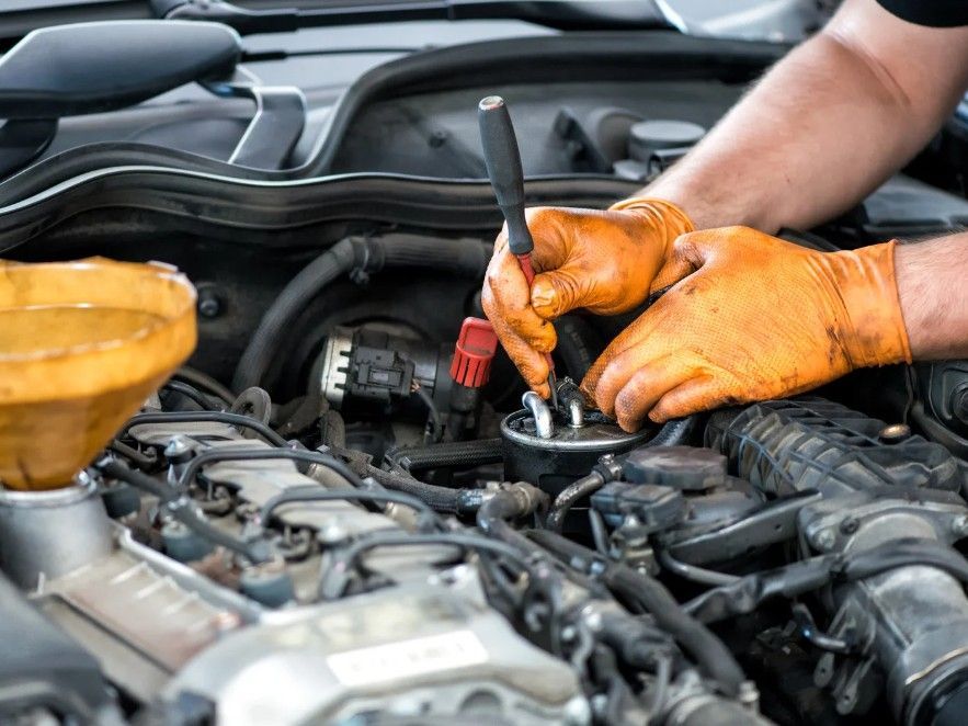 mobile mechanic fixing an engine problem