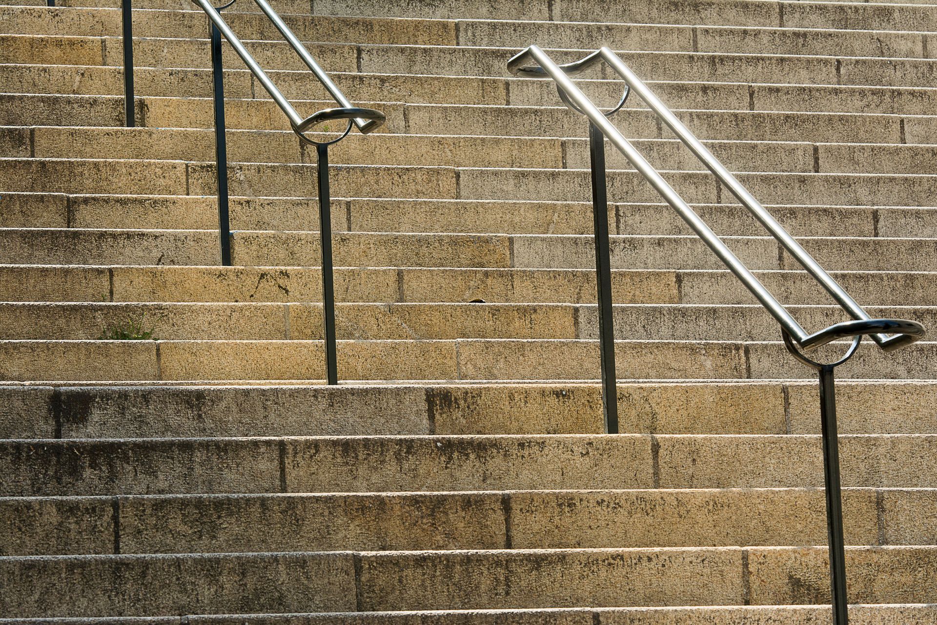 Stone steps with metal handrails
