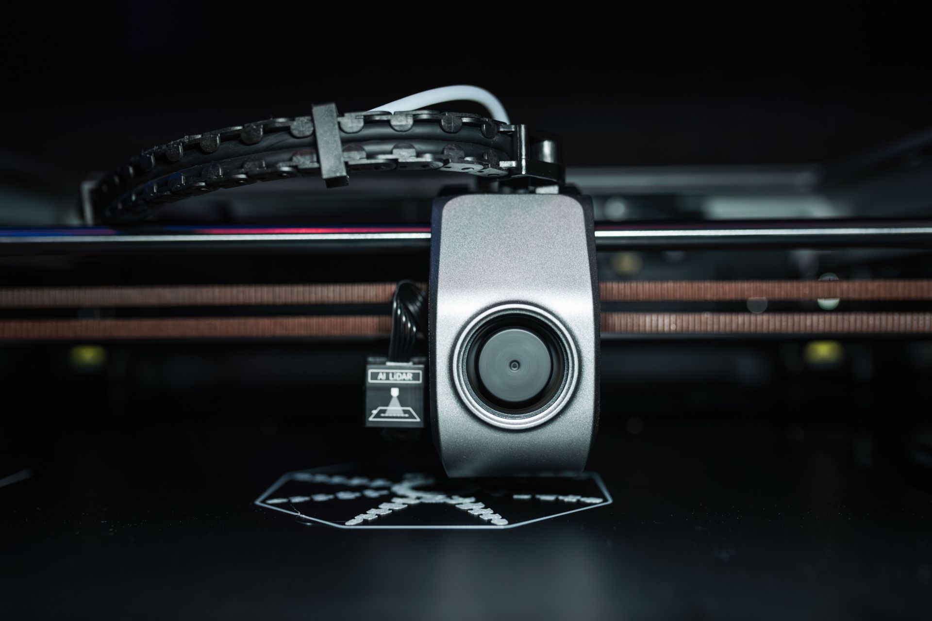 Close-up of a 3D printer print head and nozzle