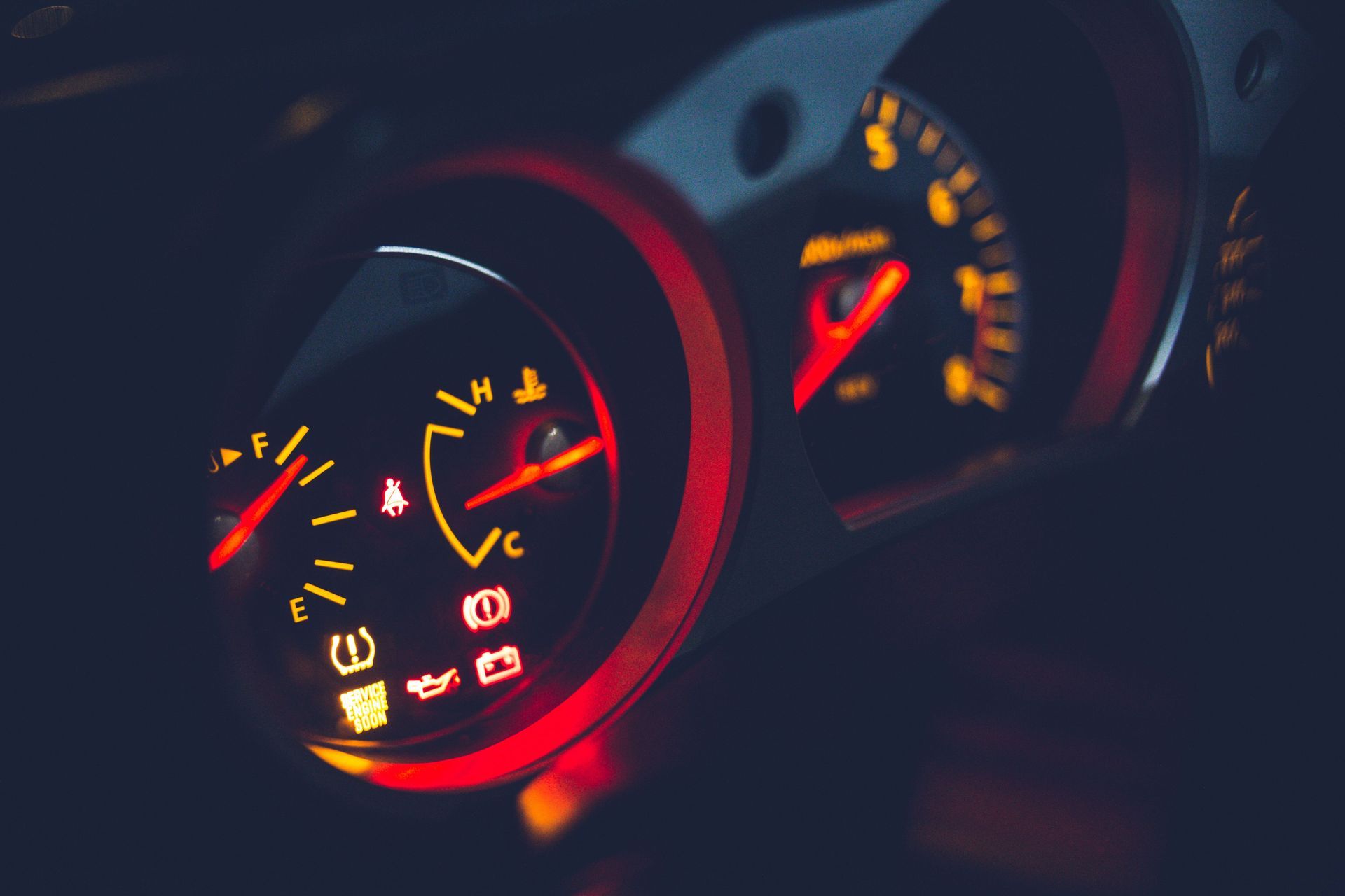 Illuminated car dashboard gauges and warning lights