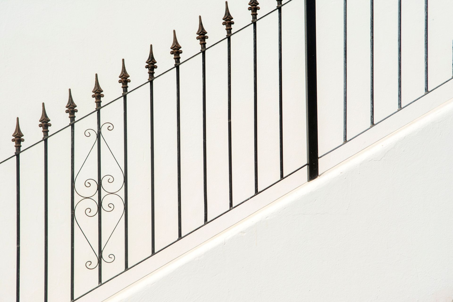 Black metal railings with spear-top finials