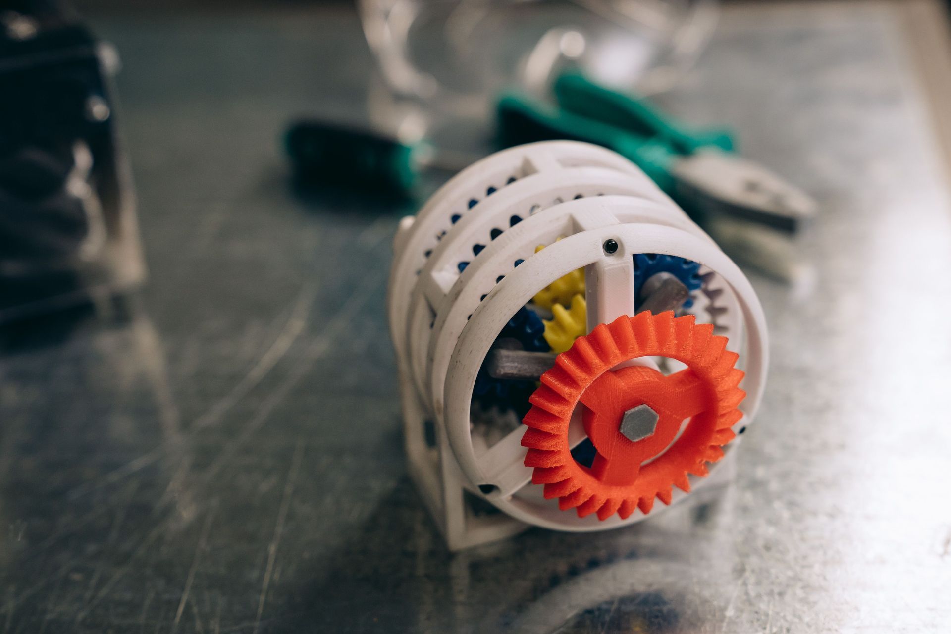 3D printed mechanical assembly with an orange gear