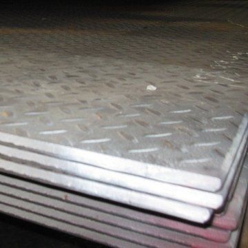 Stacked silver metal sheets with a diamond tread pattern on top