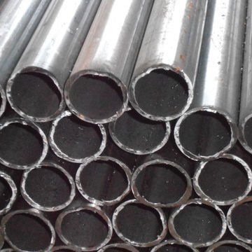 Stacked shiny metal pipes with circular openings