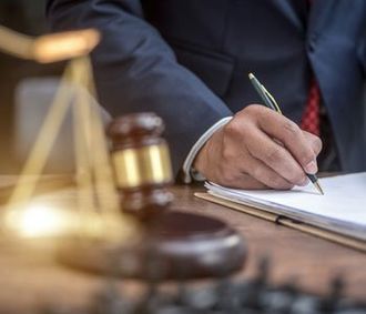 Man signing business document