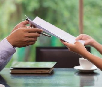 Hand of businessman giving document