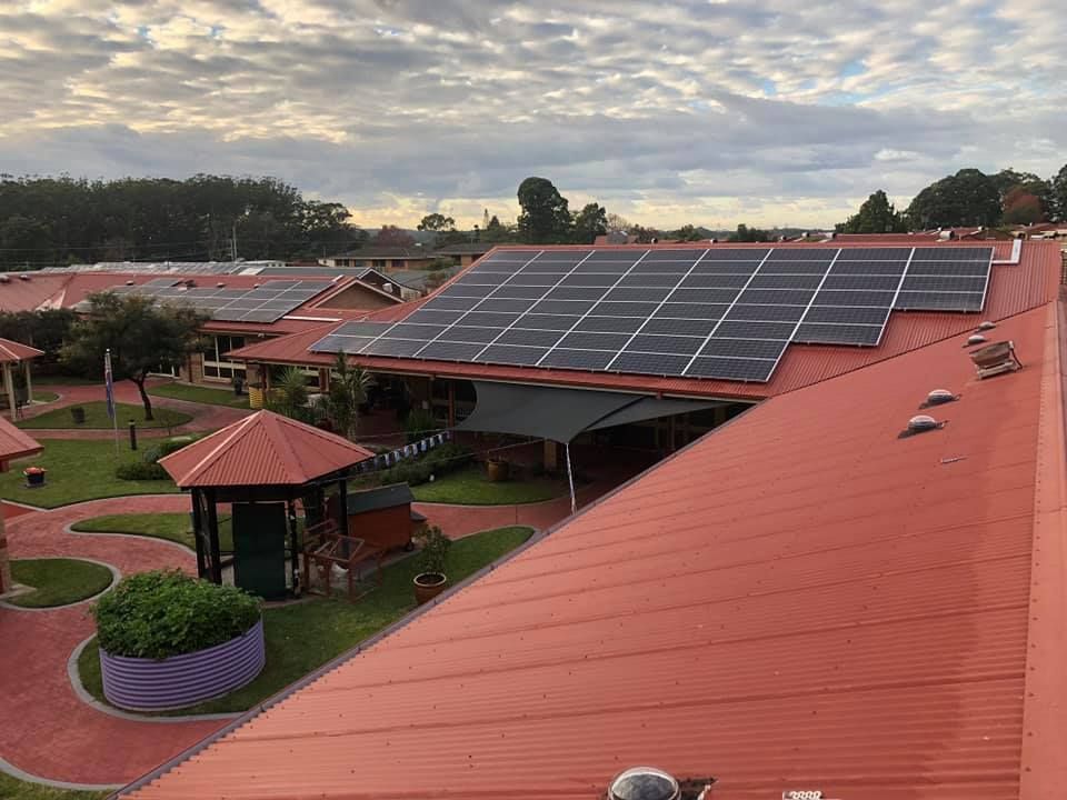 There Are Many Solar Panels on the Roof of a Building — Spot On Solar International in Lake Macquarie, NSW
