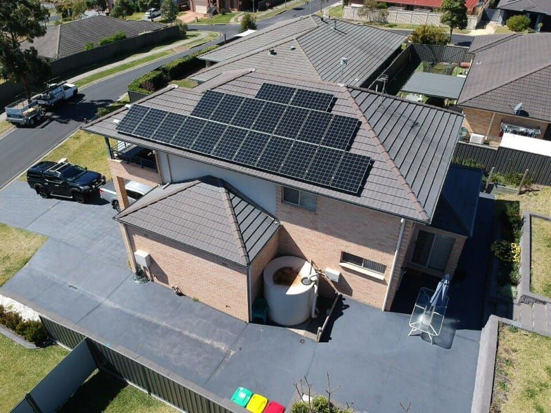 An Aerial View of a House With Solar Panels on the Roof — Spot On Solar International in Beresfield, NSW