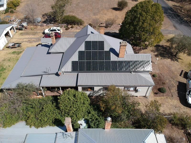 An Aerial View of a House With Solar Panels on the Roof — Spot On Solar International in Beresfield, NSW