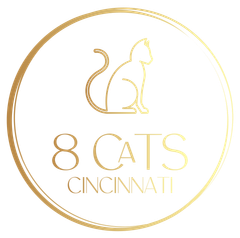 Golden logo: Cat silhouette inside a circle, with 