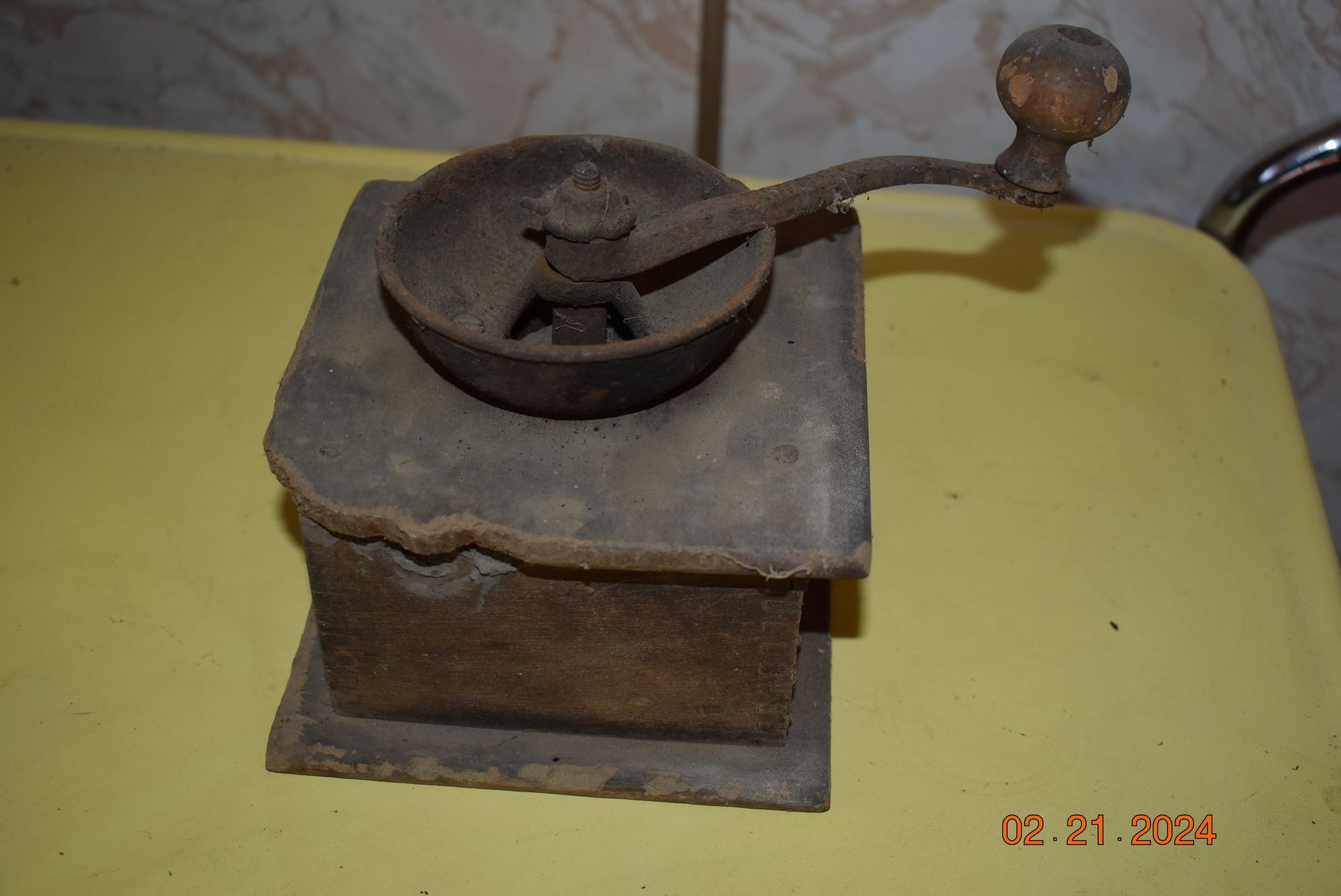 an old rusty antique coffee grinder